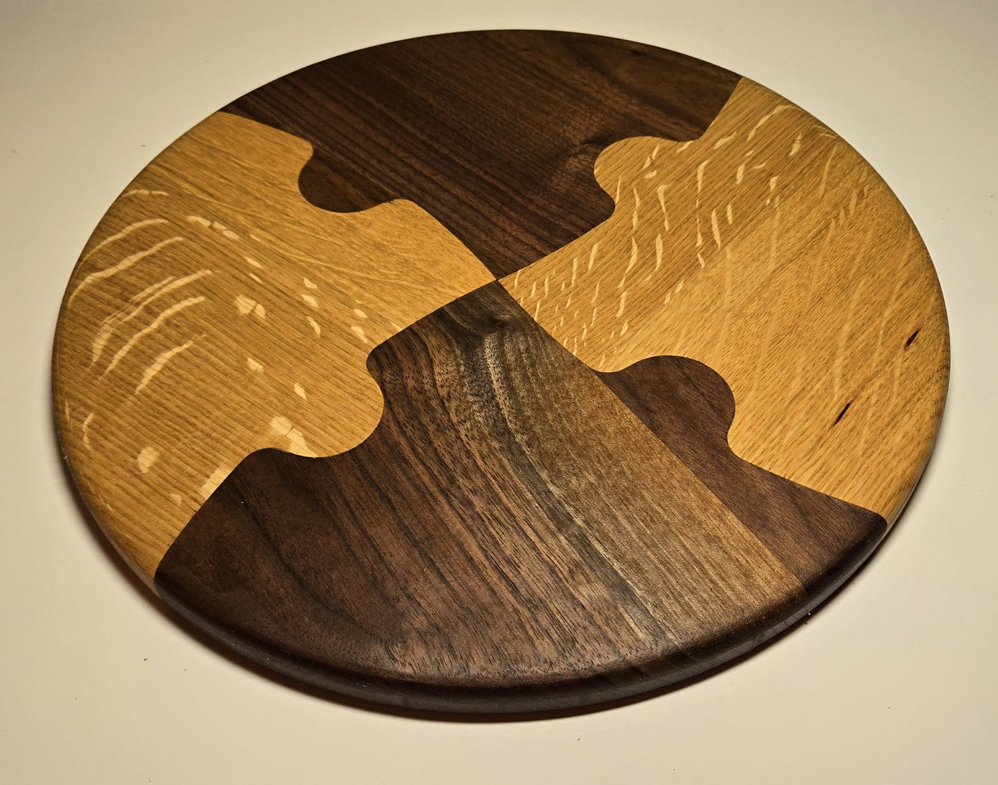 “Unity Board” — Handcrafted Round Charcuterie Board in Walnut & Oak Puzzle Design